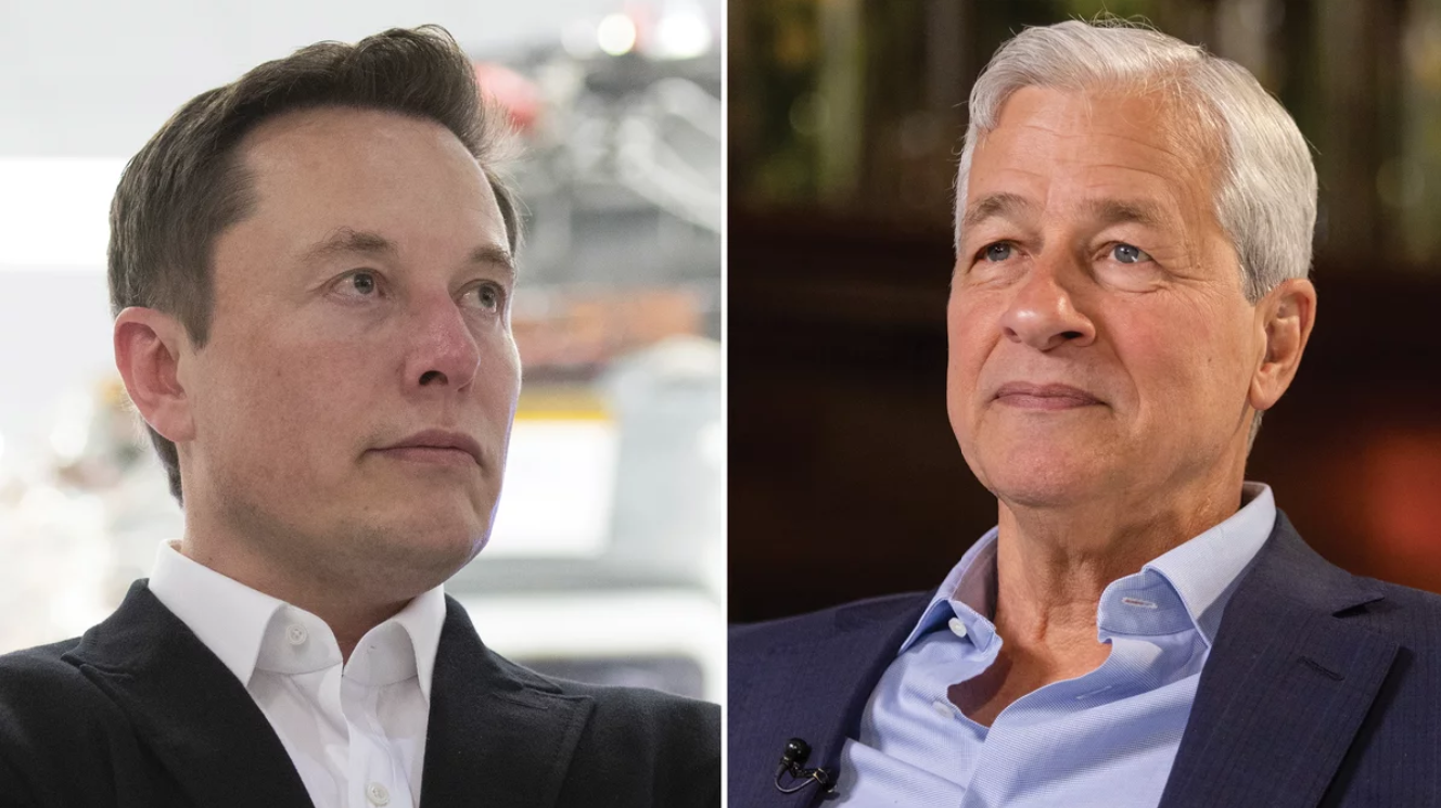 Two men in suits, one with dark hair and the other with gray hair, both looking thoughtfully.
